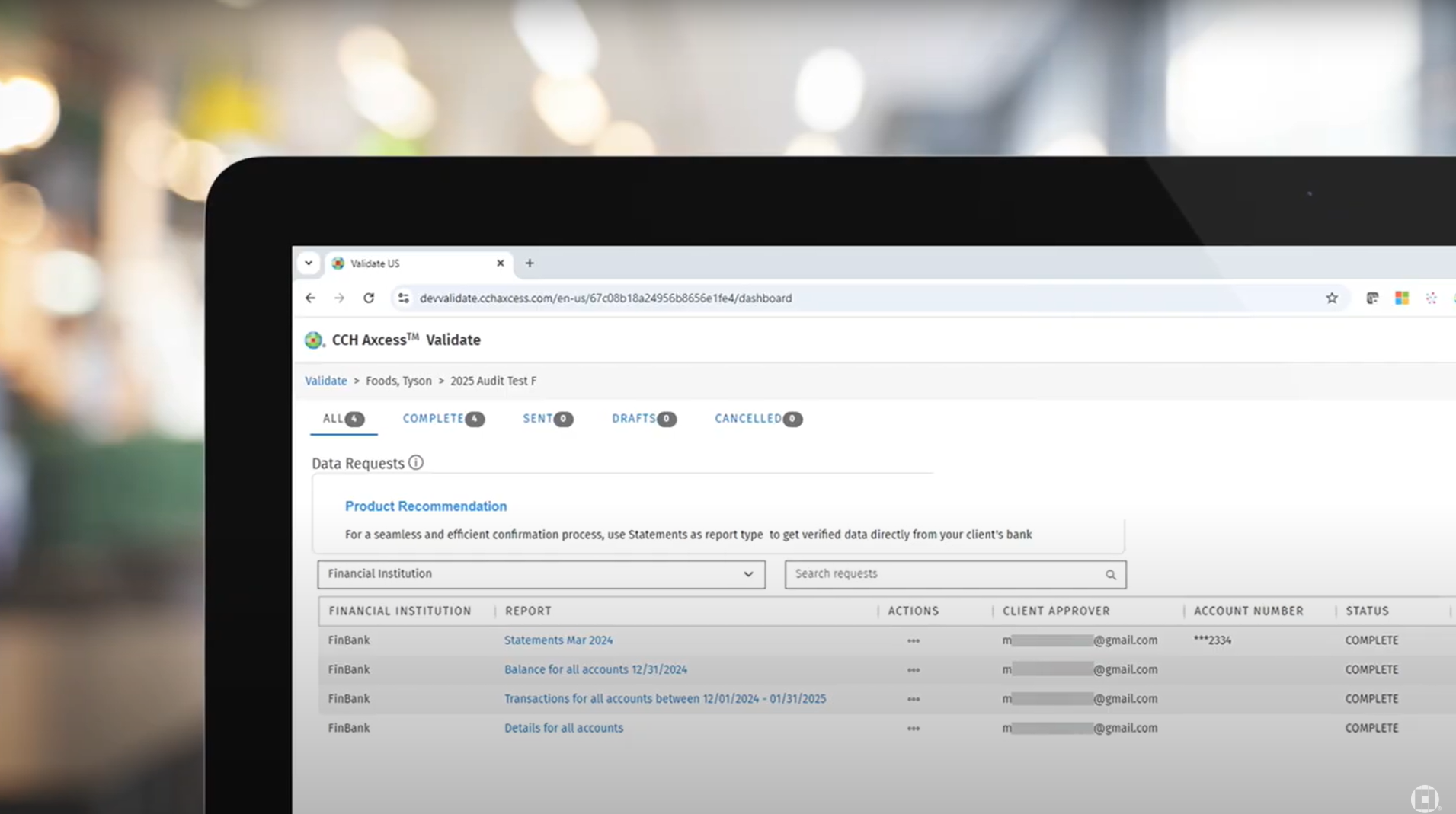 A laptop screen showing a bank transfer confirmation while a person types at a home desk, realistic photo