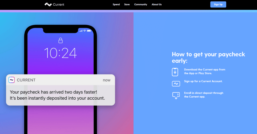 A person holding a smartphone with a banking app open while reviewing a paycheck direct deposit in a bright kitchen, real-life photo