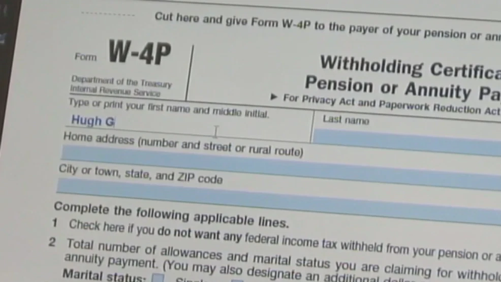 A person sorting student loan paperwork and printed emails on a kitchen table with a pen and highlighter, documentary photo