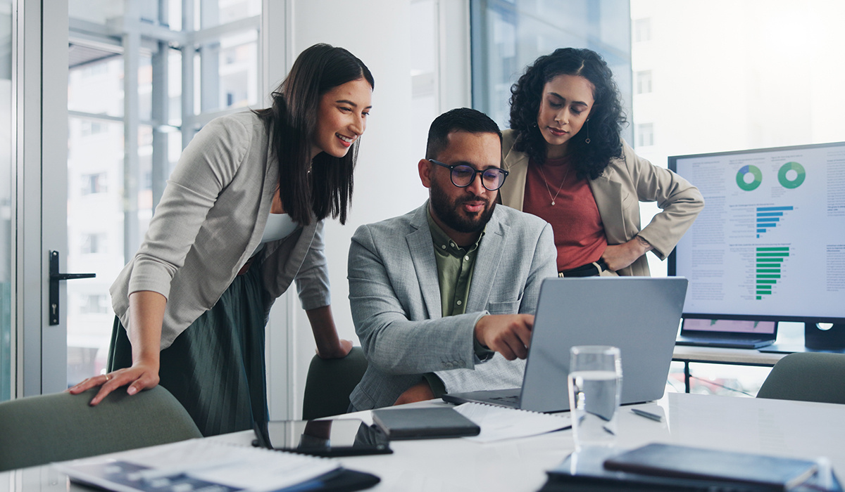 A person’s hands filling out employee benefits enrollment forms on a desk with a pen and a coffee mug nearby, realistic office photo