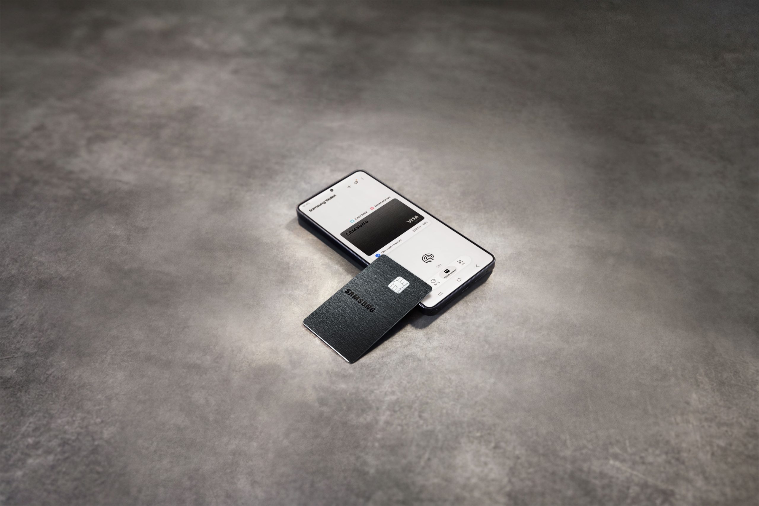 A premium black credit card resting next to a smartphone and a small stack of receipts on a kitchen table