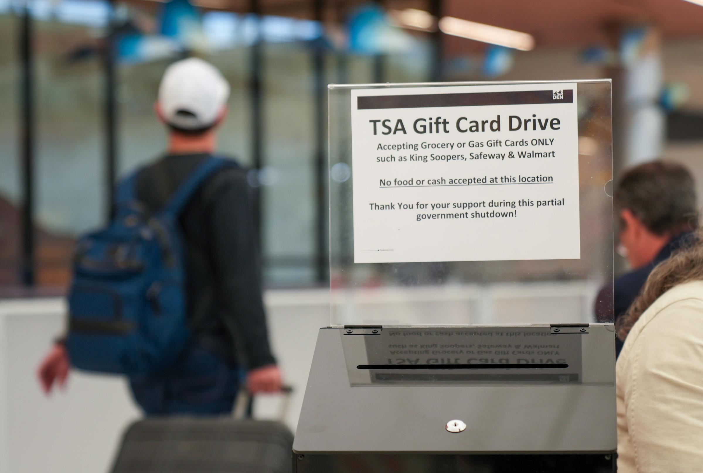 A public service worker riding a city bus in the early morning with a backpack and a student loan envelope visible, candid realistic photo