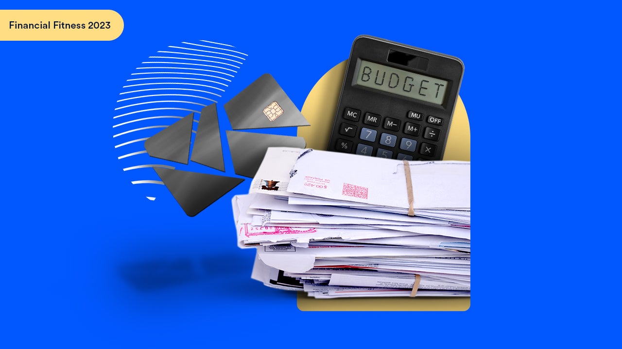 A real credit card statement and a calculator on a kitchen table next to a notebook, with someone’s hands reviewing the bill in warm indoor light, realistic photography style